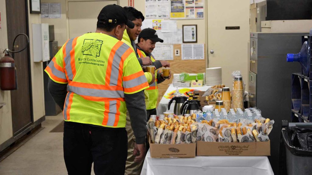 realty landscaping employees enjoying food and drink